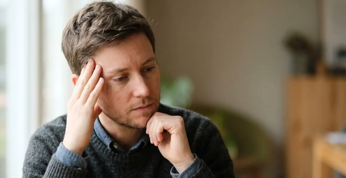 Contemplative moment depicting investor emotional response during market volatility